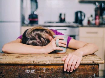 boost energy - tired woman with coffee